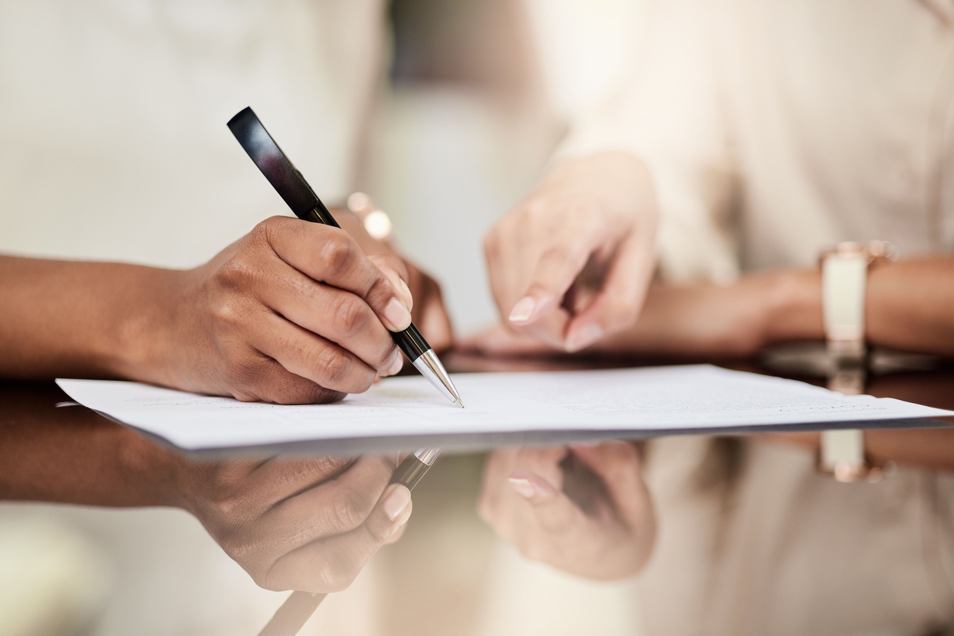 Shot of a businesswoman signing a contract